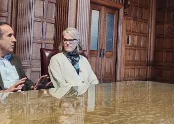 John and Katy Janicki with Marta Bertoglio, Director of the Montana Department of Commerce, and Governor Greg Gianforte seated at a conference table in the Montana Governor's office